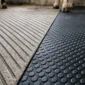 grooved concrete vs rubber matting featured 85x85